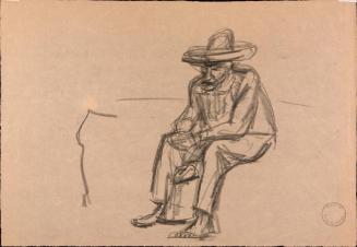 [Seated man, barefoot and wearing hat]