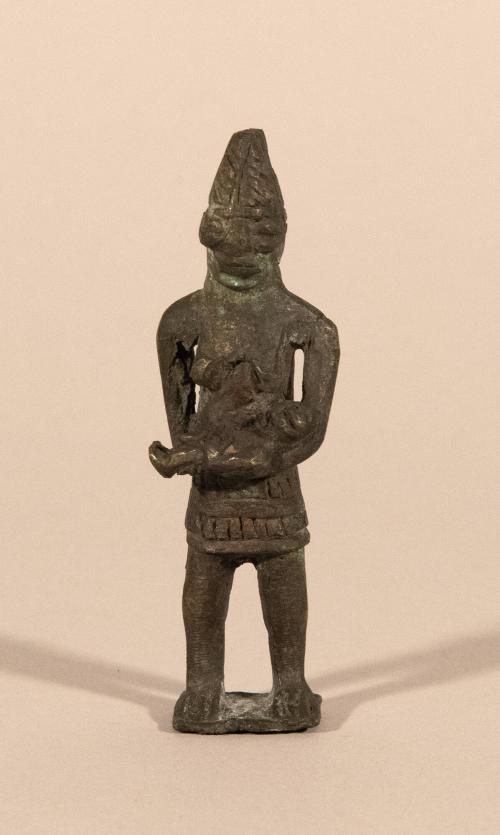 [Standing female figure]
