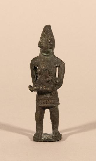 [Standing female figure]