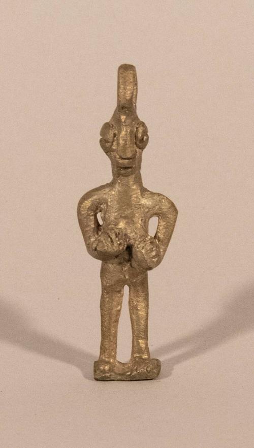 [Standing female figure]