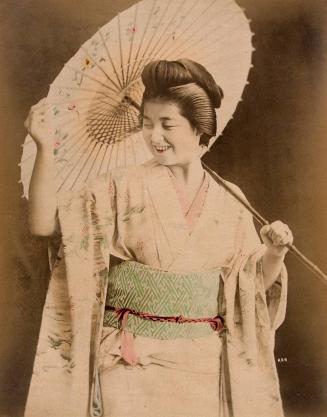 Smiling woman holding an umbrella