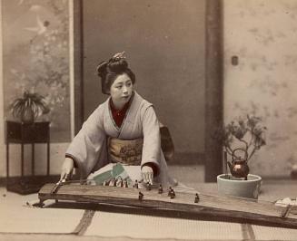 Japanese woman playing koto