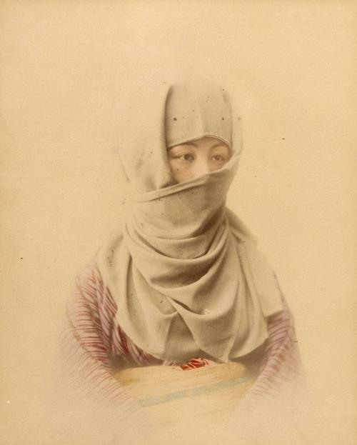 Portrait of a woman with covered head and face