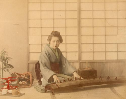 [Woman playing koto]