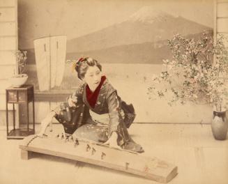 [Woman playing koto]