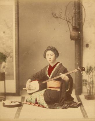 [Woman playing instrument]