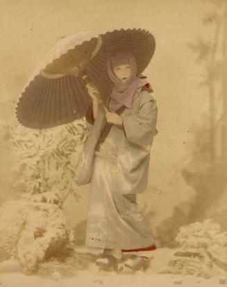 [Woman in winter scene with umbrella]