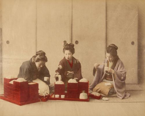 [Three women eating noodles]