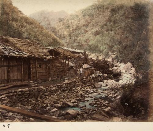 376 Village and Stream. Large rocks on roof in case of severe storms.;