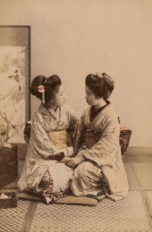 Two women holding hands