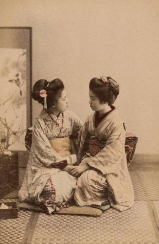 [Two women holding hands]