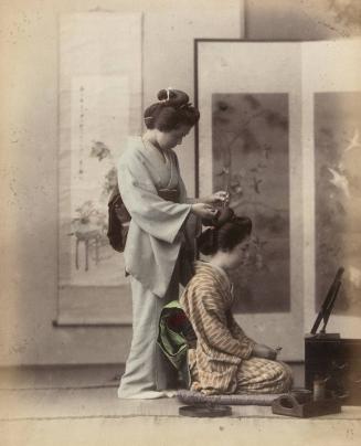 Two women creating a coiffure