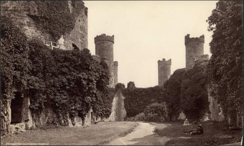 [Courtyard Conway Castle (four figures lounging on grass)]