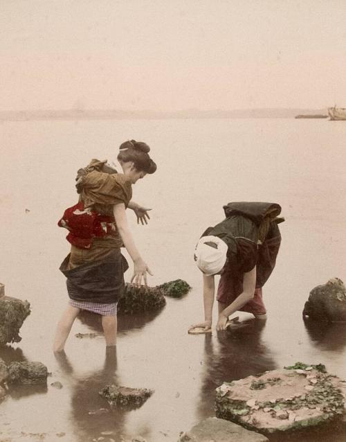 Two Girls Standing in Water