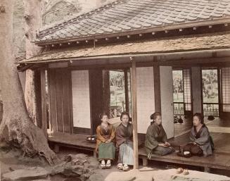 Four Women Sitting on a Porch