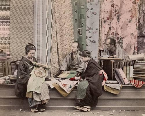 Two Ladies Choosing Material at Fabric Shop