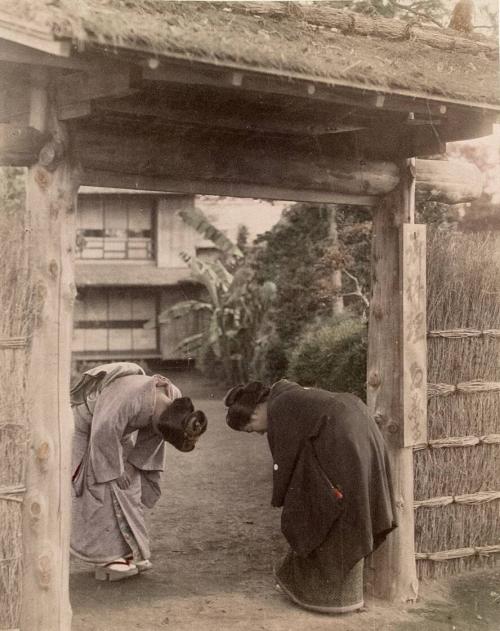 Two Women Bowing