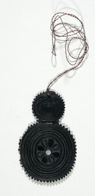 Wooden Amulet with Floral Motif