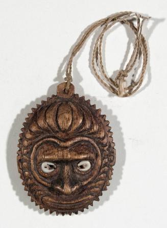 Wooden Amulet with Stylized Human Face