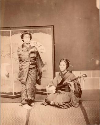 Two women, with fan and shamisen