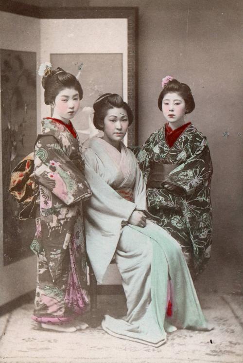 Three Women in Front of Screen