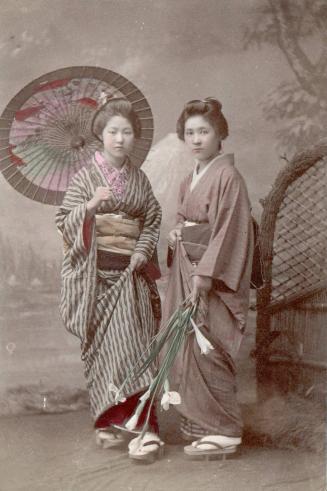 [Two Women; one holding a parasol, the other, flowers]