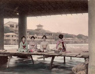 Four Women on a Wooden Dock Platform