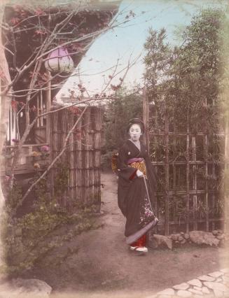 Woman at Garden Fence