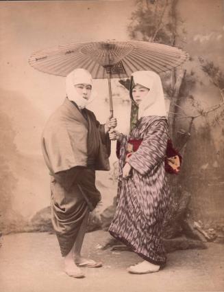 Man and Woman Under Umbrella