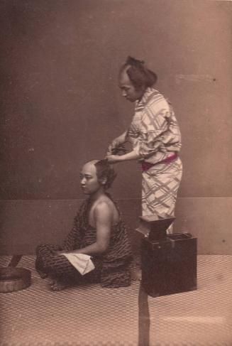 Man Doing Hair in Early Style