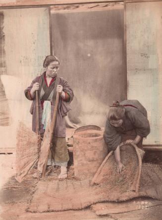 [Two women sifting rice]