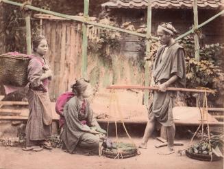 Two Women and a Man Carrying Vegatables