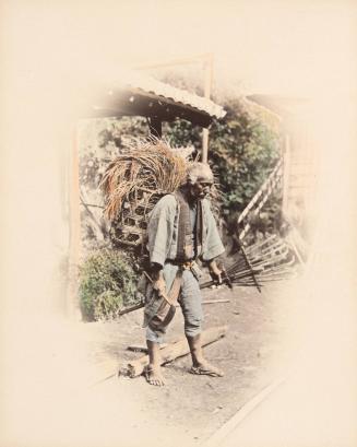 Man Carrying a Basket of Grain