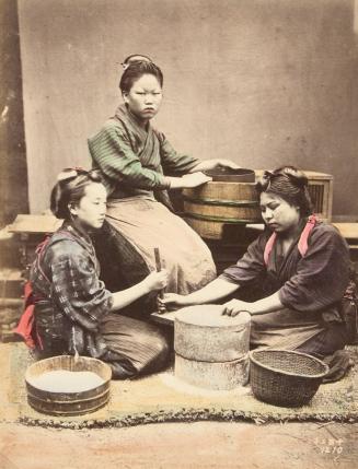 Three women packing tofu