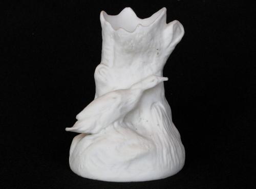 [Log-shaped parian spill vase with duck ornament]