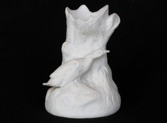 [Log shaped parian spill vase with duck ornament]