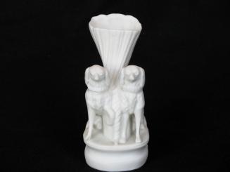 [Shell-shaped Parian vase with two dog ornaments]