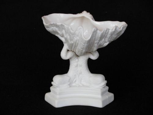 [Clam shell parian vase with dolphin tails]