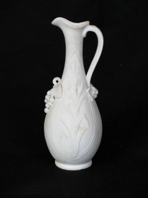 [Pear-shaped parian ewer with applied grape clusters]