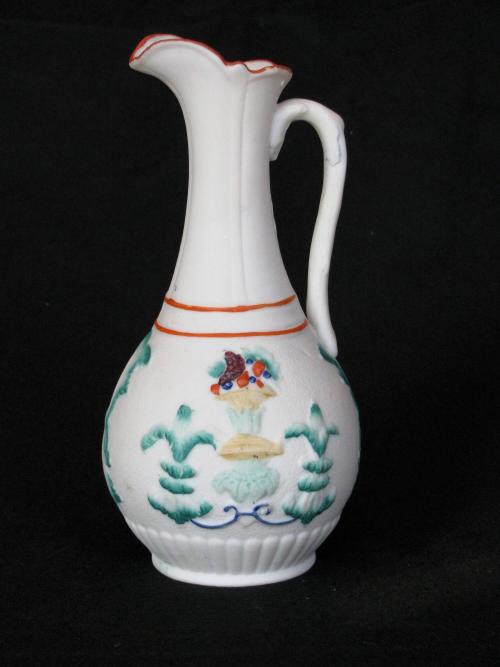 [Pear-shaped parian ewer with colored fruit basket design]