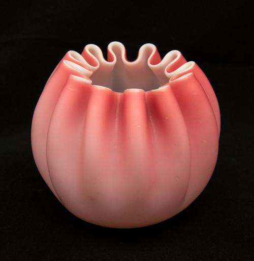 [Pink globe vase with ruffled lip]