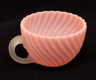 [Pink teacup with clear handle]