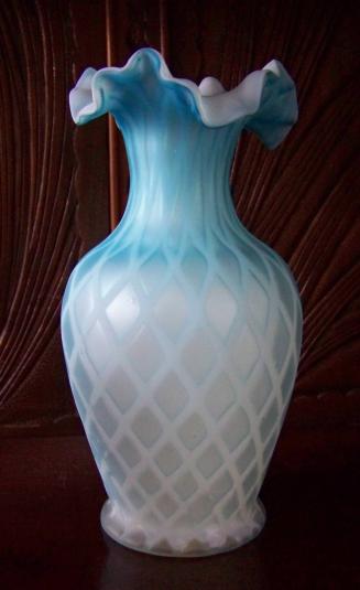 [Blue and white vase with tapered neck and ruffled tricorn lip]