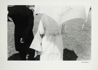 [Man and woman with umbrella]