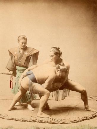 [Two Sumo wrestlers with referee]