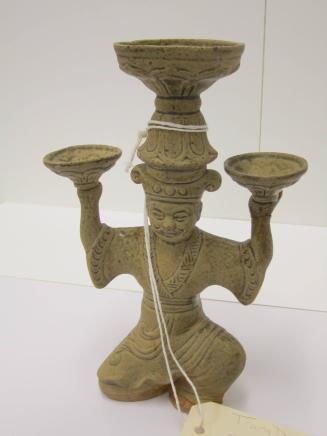 [Candlestick with male figure]