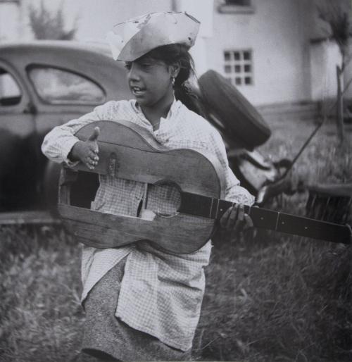 Young gypsy girl with broken guitar, Stes Maries de la Mer