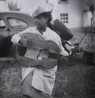 Young gypsy girl with broken guitar, 1955
