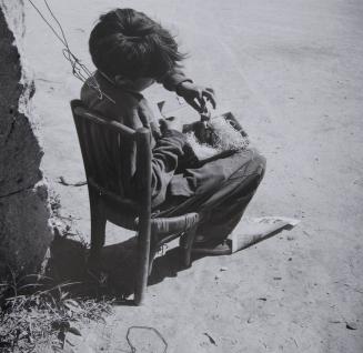Young gypsy with found bird, Arles, 1955