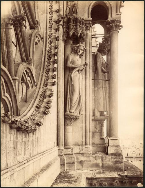 [Untitled, architectural detail, statuary, female figure with dragon]